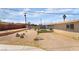 Backyard featuring a trampoline and well-kept desert landscaping at 4691 Sun Valley Cir, Las Vegas, NV 89122