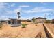 View of a spacious backyard featuring a trampoline and desert landscaping at 4691 Sun Valley Cir, Las Vegas, NV 89122