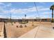View of the backyard with desert landscaping, firepit and trampoline at 4691 Sun Valley Cir, Las Vegas, NV 89122