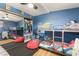 Comfortable bedroom with a bunk bed, closet with mirror and blue walls at 4691 Sun Valley Cir, Las Vegas, NV 89122