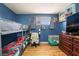 Well-lit bedroom featuring a bunk bed, desk, and neutral toned floors at 4691 Sun Valley Cir, Las Vegas, NV 89122