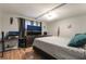 Bedroom with wood-look laminate flooring, ceiling fan, and a large window at 4691 Sun Valley Cir, Las Vegas, NV 89122