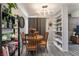Charming dining area showcasing a round table with chairs, stylish shelving, and modern light fixture at 4691 Sun Valley Cir, Las Vegas, NV 89122