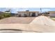 Inviting one-story home with a spacious driveway, low-maintenance yard, and convenient side gate access at 4691 Sun Valley Cir, Las Vegas, NV 89122