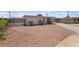 Attractive single-level home featuring a gravel front yard, fenced area, and a convenient driveway at 4691 Sun Valley Cir, Las Vegas, NV 89122