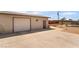 View of the detached garage with desert landscaping in the background at 4691 Sun Valley Cir, Las Vegas, NV 89122