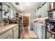 Kitchen with pale blue cabinets, wood-look laminate flooring, and stainless steel appliances at 4691 Sun Valley Cir, Las Vegas, NV 89122