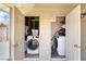 Laundry area with washer and dryer hookups and shelving at 4691 Sun Valley Cir, Las Vegas, NV 89122