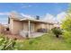 Expansive backyard featuring lush green lawn and covered patio at 4998 Rappahanock St, Las Vegas, NV 89122