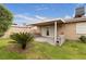 Lush backyard with grass, mature trees and covered patio at 4998 Rappahanock St, Las Vegas, NV 89122