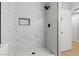 Luxurious walk-in shower with modern tiling and sleek shower head at 4998 Rappahanock St, Las Vegas, NV 89122