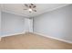 Bright bedroom featuring modern ceiling fan and light hardwood floors at 4998 Rappahanock St, Las Vegas, NV 89122