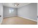 Bright bedroom featuring a large window and light hardwood floors at 4998 Rappahanock St, Las Vegas, NV 89122