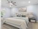 Comfortable bedroom features a ceiling fan, neutral walls, and stylish decor at 4998 Rappahanock St, Las Vegas, NV 89122