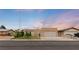 Inviting single-story home with desert landscaping, a two-car garage, and a peaceful sunset backdrop at 4998 Rappahanock St, Las Vegas, NV 89122