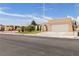 Inviting home with xeriscaping, mature landscaping, and covered entrance in a residential neighborhood at 4998 Rappahanock St, Las Vegas, NV 89122