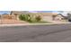 Charming single-story home with desert landscaping, a two-car garage, and a well-manicured lawn at 4998 Rappahanock St, Las Vegas, NV 89122