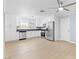 Well-lit kitchen with stainless steel appliances and ample cabinet space at 4998 Rappahanock St, Las Vegas, NV 89122