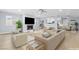 Spacious living room with fireplace, neutral tones, and plenty of natural light at 4998 Rappahanock St, Las Vegas, NV 89122