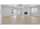Spacious living room with a fireplace and access to the backyard at 4998 Rappahanock St, Las Vegas, NV 89122