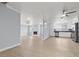 Bright, airy living area featuring a fireplace and seamless flow to the kitchen at 4998 Rappahanock St, Las Vegas, NV 89122