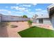 The backyard features brick and concrete patios, as well as artificial grass at 508 Van Dornum Ave, Henderson, NV 89011