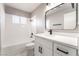 Clean and stylish bathroom with sleek vanity, marble floors, and modern fixtures at 508 Van Dornum Ave, Henderson, NV 89011