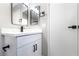 Modern bathroom vanity with quartz countertops, sleek hardware, and designer mirrors at 508 Van Dornum Ave, Henderson, NV 89011