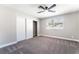 Cozy bedroom features a ceiling fan, closet with sliding doors, and a sunlit window at 508 Van Dornum Ave, Henderson, NV 89011