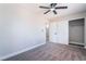 Spacious bedroom with gray carpet, ceiling fan, and access to bathroom and closet at 508 Van Dornum Ave, Henderson, NV 89011