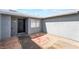 View of the front door with gray stucco and low maintenance landscaping at 508 Van Dornum Ave, Henderson, NV 89011