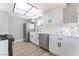 The remodeled kitchen features new stainless steel appliances, white cabinets, and modern countertops at 508 Van Dornum Ave, Henderson, NV 89011
