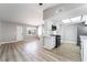 Open kitchen with white cabinets, island, and modern stainless steel appliances at 508 Van Dornum Ave, Henderson, NV 89011