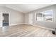 Spacious living room featuring modern floors, neutral walls and trim at 508 Van Dornum Ave, Henderson, NV 89011