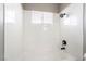 Bright white shower with tile walls and updated fixtures at 508 Van Dornum Ave, Henderson, NV 89011