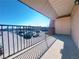 Balcony view with a fenced perimeter overlooking a parking lot at 5321 River Glen Dr # 232, Las Vegas, NV 89103
