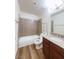 Bathroom featuring shower-tub combo with granite vanity and sleek fixtures at 5321 River Glen Dr # 232, Las Vegas, NV 89103