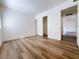 Bedroom featuring wood-look flooring, ample space, and closet for comfort and storage at 5321 River Glen Dr # 232, Las Vegas, NV 89103
