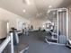 Community gym space with ceiling fan and weightlifting machines at 5321 River Glen Dr # 232, Las Vegas, NV 89103