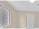 An empty bedroom with a window and closet at 5820 Royal Castle Ln, Las Vegas, NV 89130