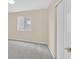 A cozy bedroom with neutral colored walls and plush carpet at 5820 Royal Castle Ln, Las Vegas, NV 89130
