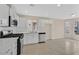 Bright kitchen with white cabinets, stainless steel appliances, tile floors and eat in nook at 5820 Royal Castle Ln, Las Vegas, NV 89130