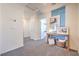 Neutral hallway with decor and artwork leading to other rooms in the home at 6109 Aster Garden St # 159, North Las Vegas, NV 89081