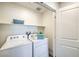Bright laundry room with modern washer and dryer, plus ample storage space at 6109 Aster Garden St # 159, North Las Vegas, NV 89081