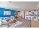Open living space with stylish decor, connecting the living room, dining area, and kitchen at 6109 Aster Garden St # 159, North Las Vegas, NV 89081