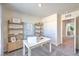 Bright office space with shelving, a work desk, and plenty of natural light at 6109 Aster Garden St # 159, North Las Vegas, NV 89081