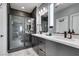 Modern bathroom featuring a double vanity with a dark finish, shower, and sleek finishes at 649 Tranquil Jade St, Las Vegas, NV 89138