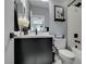 Modern bathroom featuring a sleek vanity, a decorative mirror, and a shower over bath at 649 Tranquil Jade St, Las Vegas, NV 89138