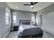 Well-lit bedroom featuring a bed, closet, ample natural light, and modern ceiling fan at 649 Tranquil Jade St, Las Vegas, NV 89138