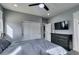 Well-lit bedroom featuring a bed, closet, ample natural light, and TV at 649 Tranquil Jade St, Las Vegas, NV 89138